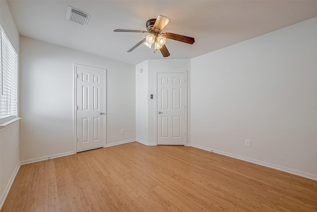 unfurnished bedroom featuring ceiling fan and light wood-type flooring