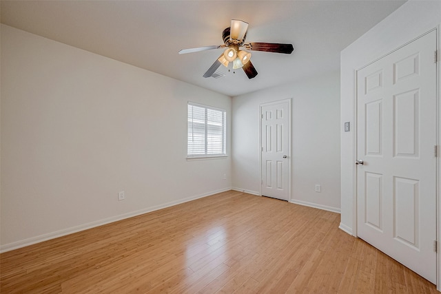 unfurnished bedroom featuring ceiling fan, a closet, and light hardwood / wood-style flooring