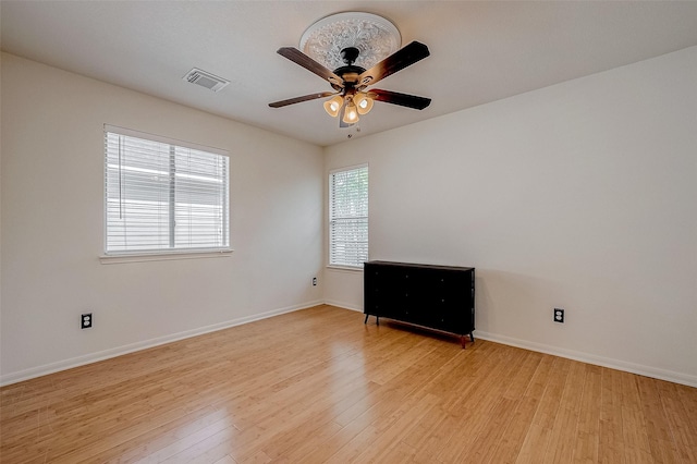 unfurnished room with ceiling fan and light hardwood / wood-style flooring