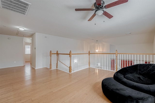 sitting room featuring hardwood / wood-style flooring and ceiling fan