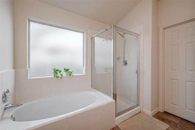 bathroom with tile patterned flooring and plus walk in shower