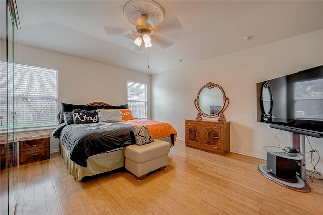 bedroom featuring ceiling fan and light hardwood / wood-style floors