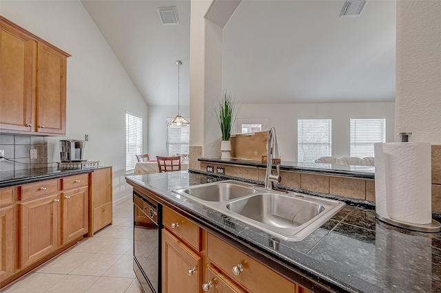 kitchen featuring light tile patterned flooring, sink, vaulted ceiling, dishwasher, and pendant lighting