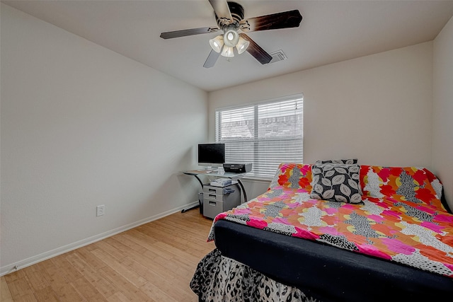 bedroom with ceiling fan and light hardwood / wood-style floors