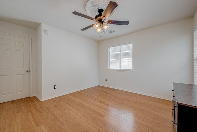 unfurnished room featuring ceiling fan and light wood-type flooring