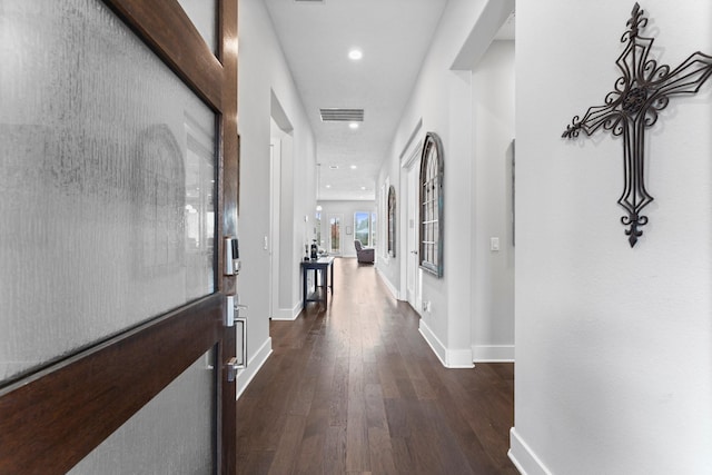 corridor featuring dark wood-type flooring