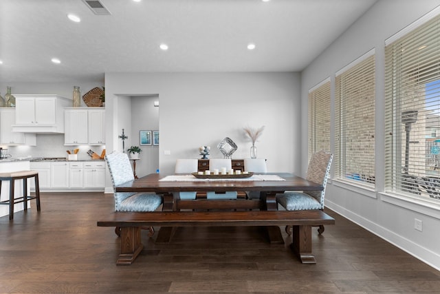 dining room with dark wood-type flooring