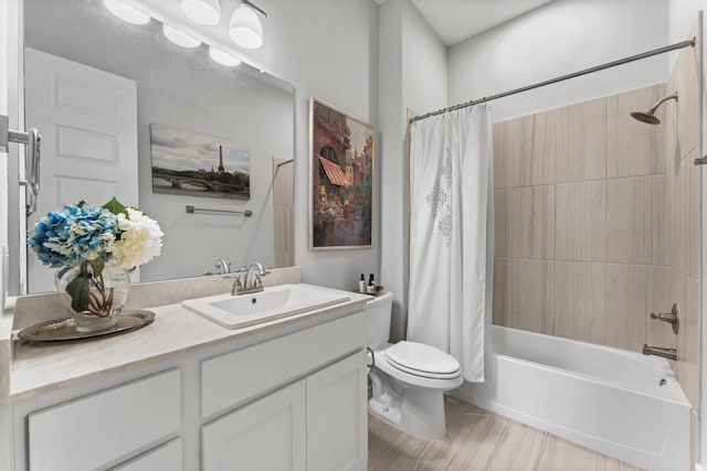 full bathroom featuring shower / bathtub combination with curtain, vanity, and toilet