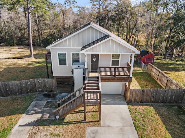 bungalow featuring a garage and a front yard