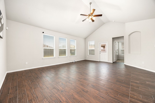 unfurnished living room with ceiling fan, dark hardwood / wood-style floors, and high vaulted ceiling