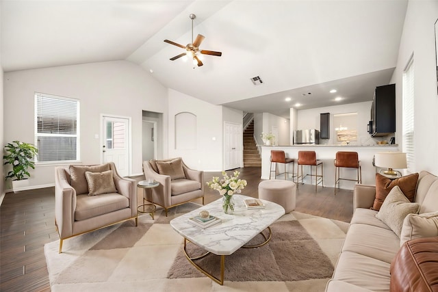 living room featuring high vaulted ceiling, light hardwood / wood-style floors, and ceiling fan