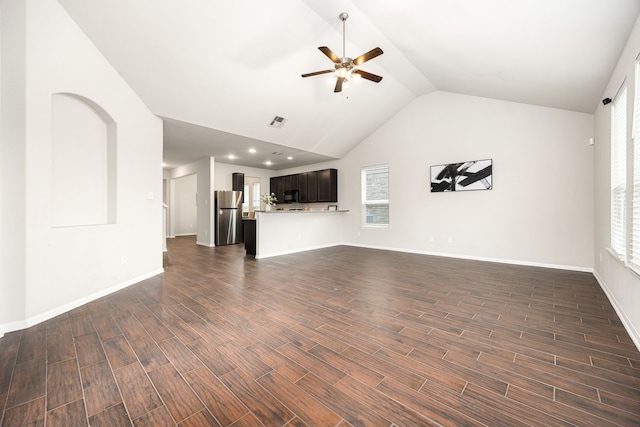 unfurnished living room with ceiling fan, dark hardwood / wood-style flooring, and high vaulted ceiling