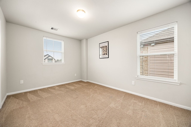 unfurnished room with carpet flooring