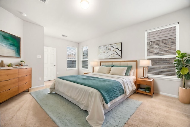 bedroom with light colored carpet