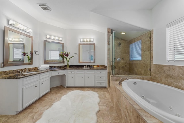 bathroom with vanity and separate shower and tub