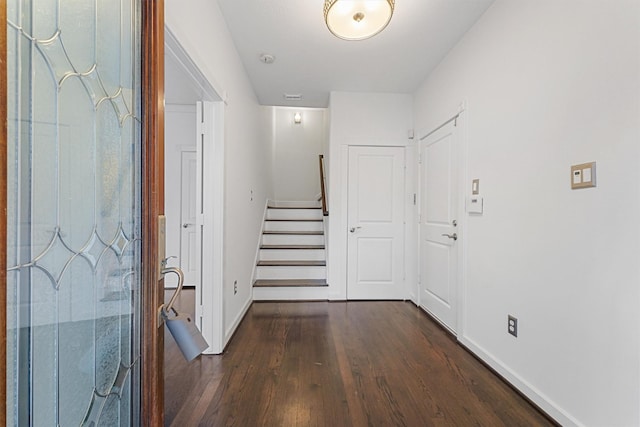 corridor with dark wood-type flooring