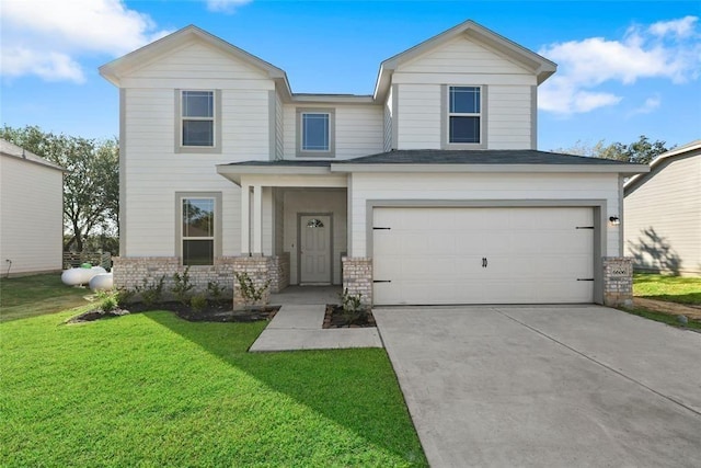 view of front of property featuring a garage and a front yard