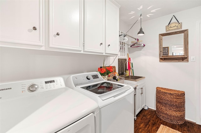 washroom with cabinets, separate washer and dryer, sink, and dark hardwood / wood-style flooring