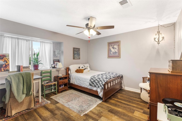 bedroom featuring ceiling fan and dark hardwood / wood-style floors