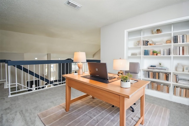 carpeted office featuring built in features