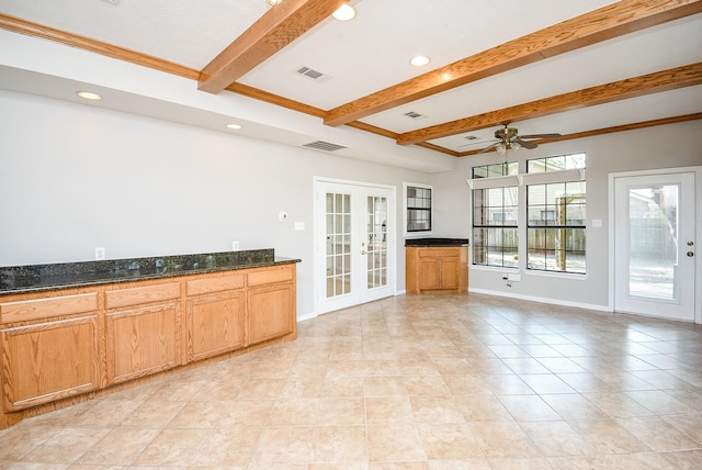 unfurnished living room featuring light tile patterned floors, beam ceiling, french doors, and ceiling fan