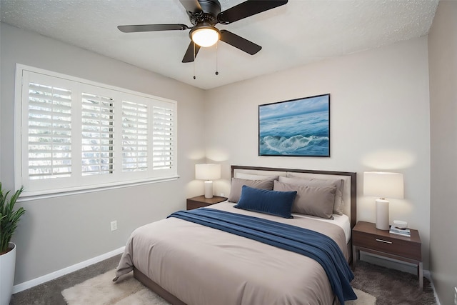 bedroom with ceiling fan and carpet