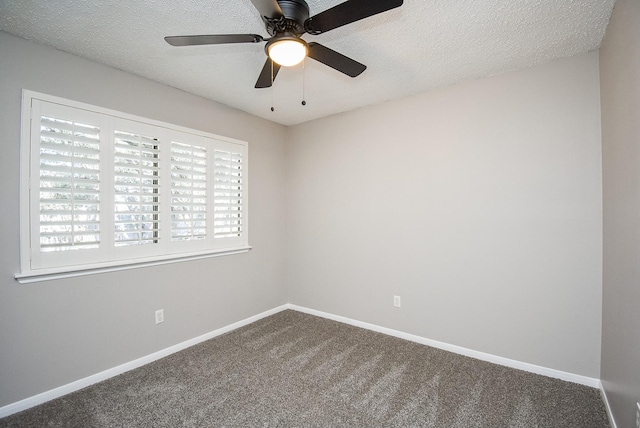 spare room featuring ceiling fan, carpet flooring, and a textured ceiling