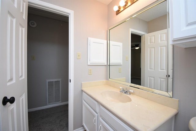 bathroom featuring vanity and ceiling fan