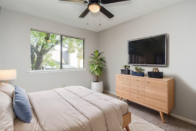 carpeted bedroom with ceiling fan