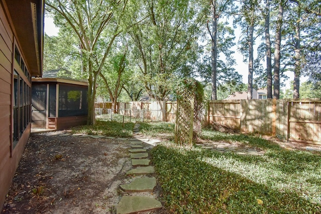 view of yard with a sunroom