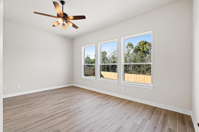 empty room featuring light hardwood / wood-style floors and ceiling fan