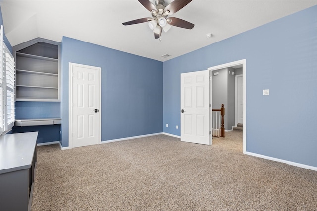 unfurnished bedroom with lofted ceiling, carpet floors, and ceiling fan