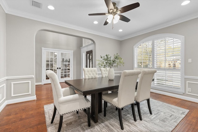 dining area featuring french doors, ceiling fan, crown molding, and hardwood / wood-style floors