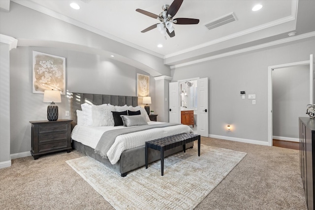 bedroom featuring crown molding, connected bathroom, light carpet, and ceiling fan