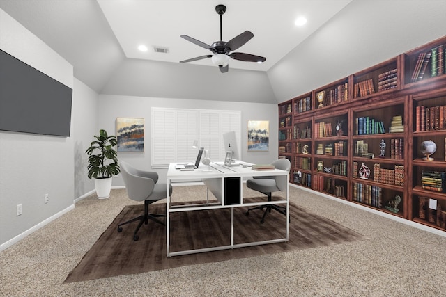 office area featuring carpet floors, ceiling fan, and vaulted ceiling