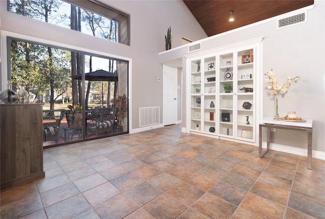 interior space with high vaulted ceiling and wooden ceiling