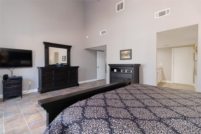 bedroom featuring a high ceiling