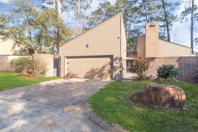 view of property exterior with a garage and a yard