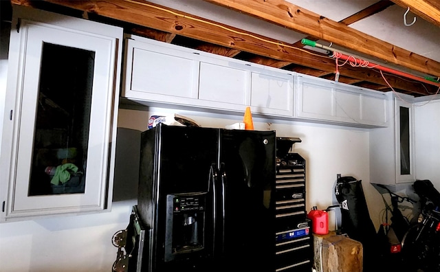 interior space featuring black fridge with ice dispenser