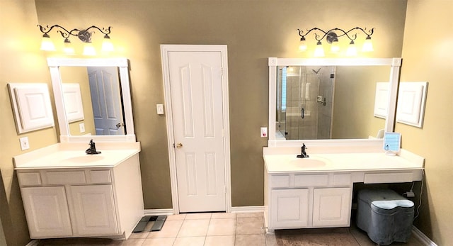 bathroom featuring vanity, a shower with shower door, and tile patterned floors