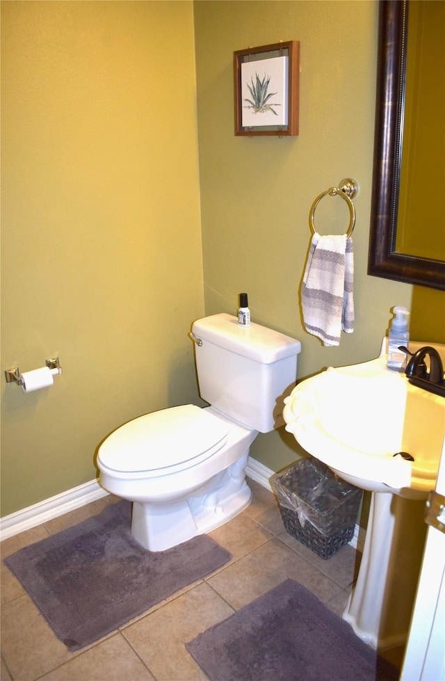 bathroom with sink, tile patterned floors, and toilet