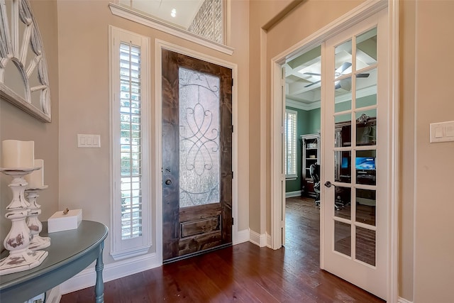 entryway with dark wood-type flooring, plenty of natural light, and french doors