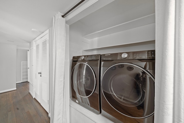 laundry room with dark wood-type flooring and independent washer and dryer