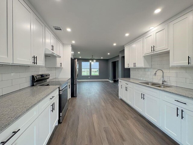 5053 E Fm 485, Cameron, TX 76520 - kitchen with white cabinetry, sink, and appliances with stainless steel finishes