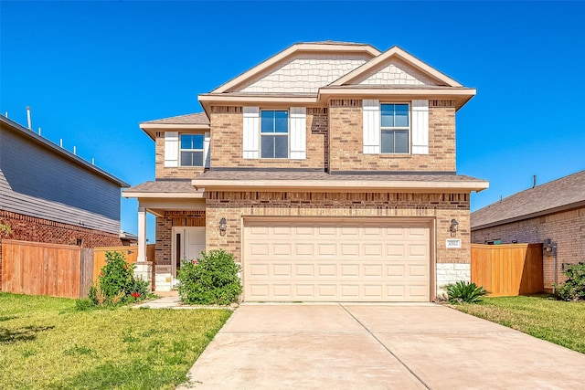 view of front of home featuring a garage and a front yard