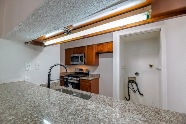 kitchen featuring appliances with stainless steel finishes and sink