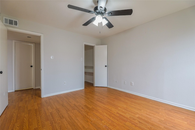 unfurnished bedroom featuring ceiling fan and light wood-type flooring