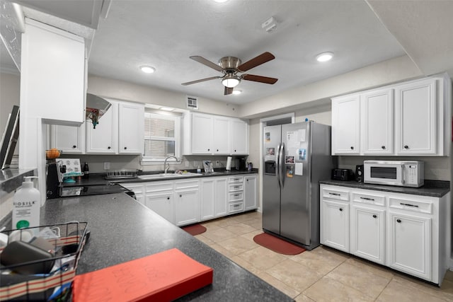 kitchen with light tile patterned flooring, sink, white cabinets, ceiling fan, and stainless steel fridge with ice dispenser