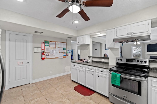 kitchen with ceiling fan, electric range, light tile patterned floors, and white cabinets