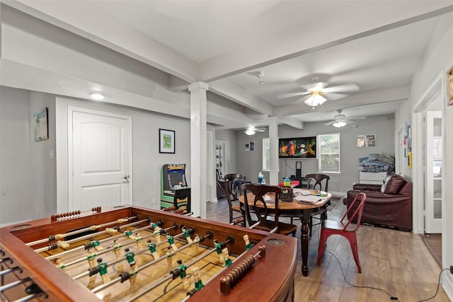 game room featuring hardwood / wood-style flooring, ceiling fan, and decorative columns